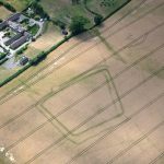 An image of an aerial shot of a double ditched enclosure near Much Wenlock as part of Shropshire Council's historic environment team's aerial survey.