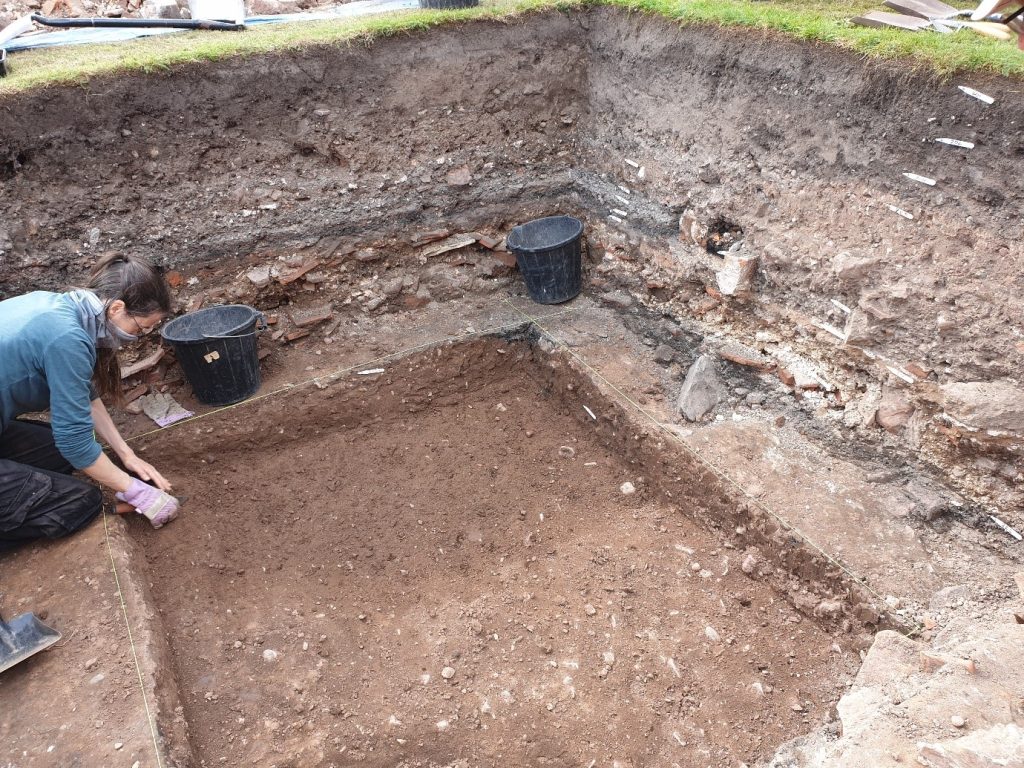 Morn cleans up our first proper Medieval layer. Photo Liz Painter.