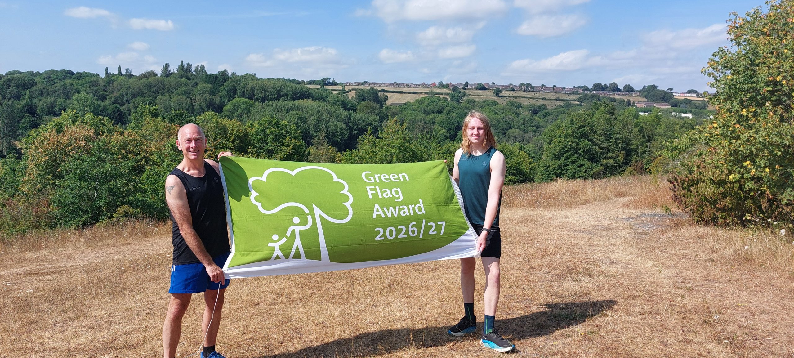 Andy Judd and Luke Lowe, who regularly run and volunteer at parkrun each Saturday, helping to celebrate another Green Flag Award at Severn Valley Country Park