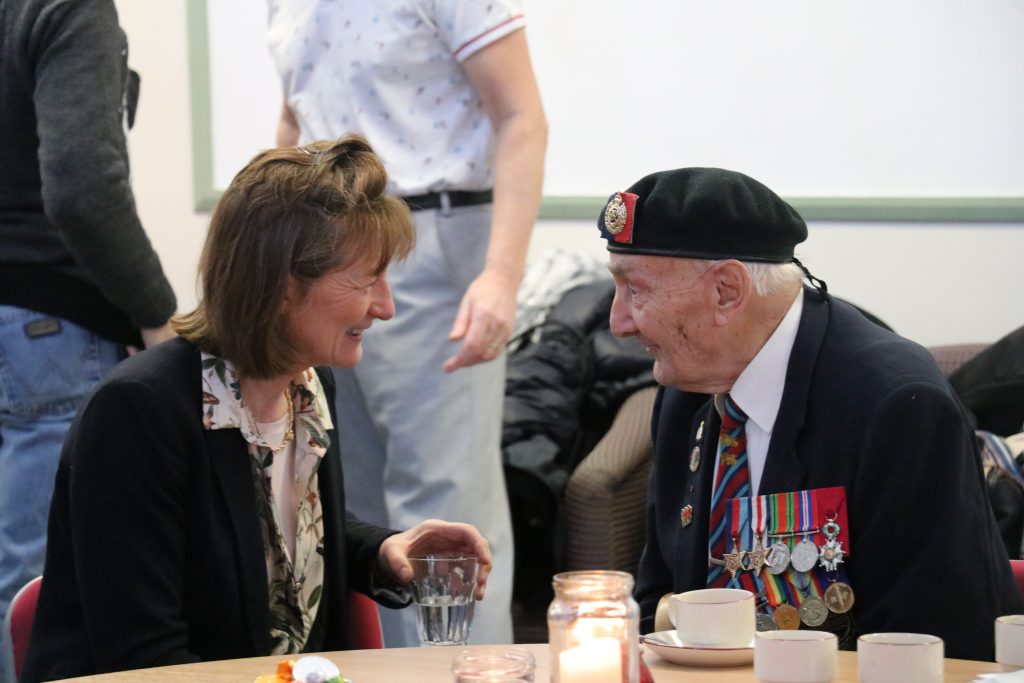Anna (Shropshire Council) and Les Stocking, a D-Day veteran, enjoy catching up at our Christmas Armed Forces Outreach back in 2019 at Palmers Café in Shrewsbury.