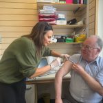 Berne Bentick getting his flu vaccination at Lunt's Pharmacy in Belle Vue.