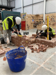 Bricklayers laying bricks