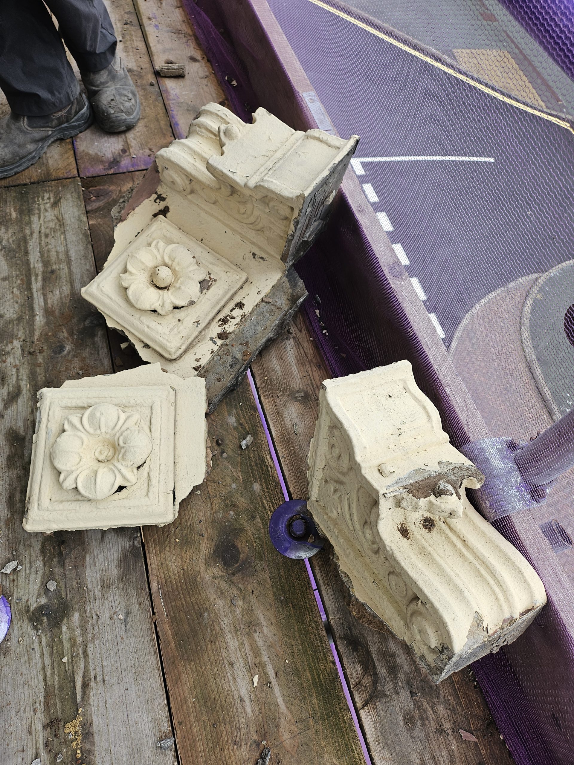 Falling corbels caught by the scaffolding.