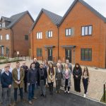 Cornovii Developments staff and Councillor Dean Carroll standing in front of one of the newly constructed houses