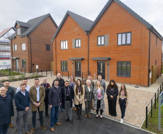 Cornovii Developments staff and Councillor Dean Carroll standing in front of one of the newly constructed houses