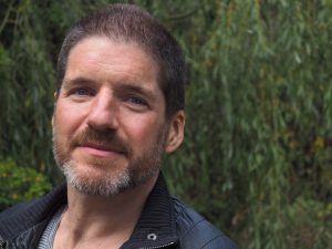 An image of Charlie Adlard whose internationally famous work in comics including The Walking Dead will feature in a new exhibition at Shrewsbury Museum and Art Gallery, Drawn of the Dead. 