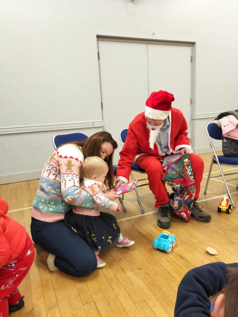 Charlotte Pryce and her daughter Eira enjoyed Santa’s visit after Shropshire Council mobile library driver Chris Wood saved the day