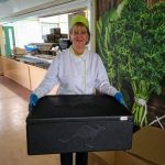 Claire Downing, Column Restaurant manager with a box of hot lunches ready for distribution.