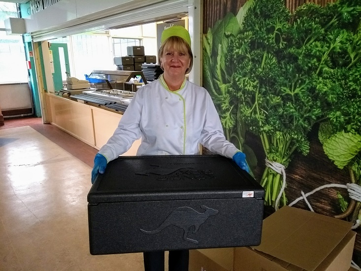Claire Downing, Column Restaurant manager with a box of hot lunches ready for distribution.