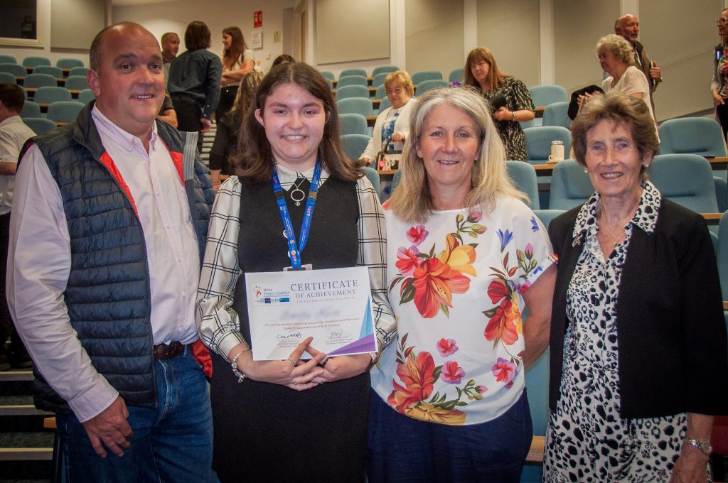 Intern celebrating their graduation with their family