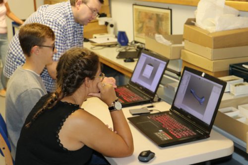 An image of volunteers digitising collections with the Fossils in Shropshire project. 