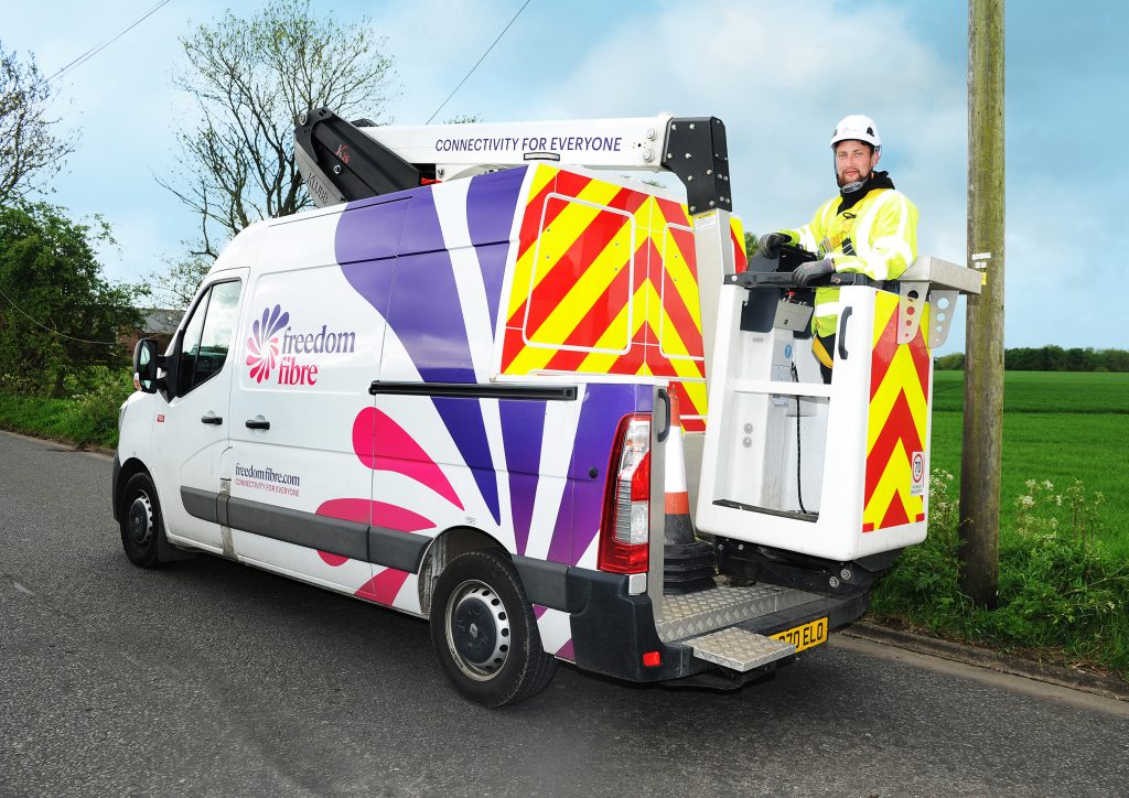 A van and a worker installing broadband