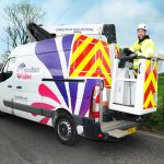 A van and a worker installing broadband
