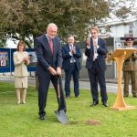 Air Vice Marshal Anthony J. Stables, Chairman of the Headley Court Charity, cuts the first piece of ground to mark the start of work on the Headley Court Veterans’ Orthopaedic Centre.
