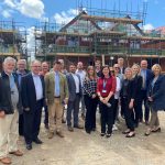 Representatives of Cornovii Developments Limited and STAR Housing with tour delegates at Aspen Grange in Weston Rhyn