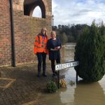An image of a Shropshire Council officer offering support to a resident affected by the flooding in Shropshire.