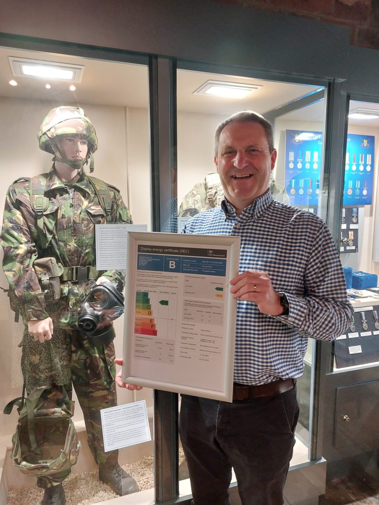 Ian Nellins holding the energy rating certificate