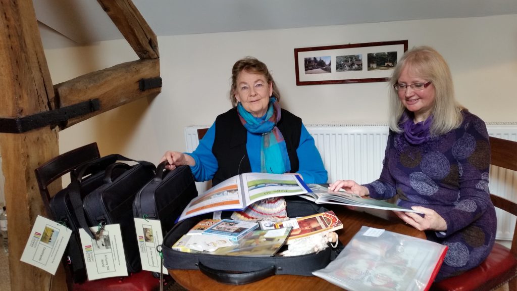 An image of Lady Forester and a lady with the four shared memory bags the Trust funded for Shropshire Library Service.
