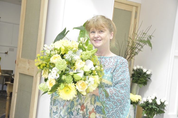 Lorraine Johnson with bouquet of flowers