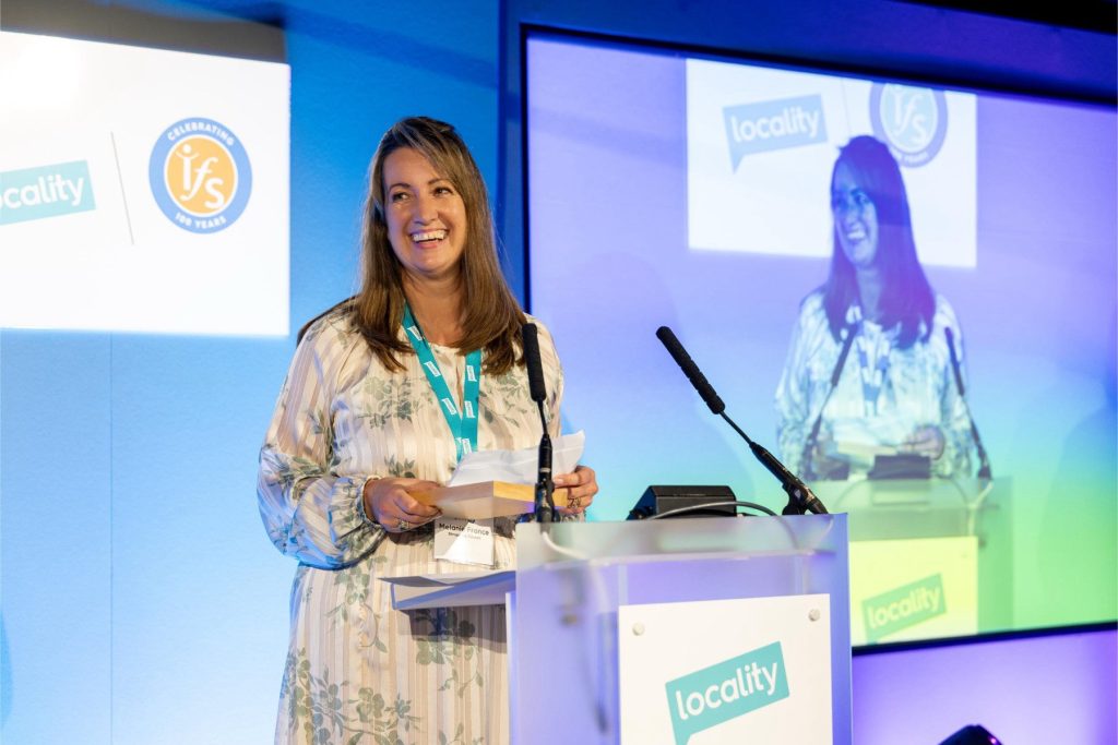 Public Health Principal Mel France collecting the 'Keep It Local' award