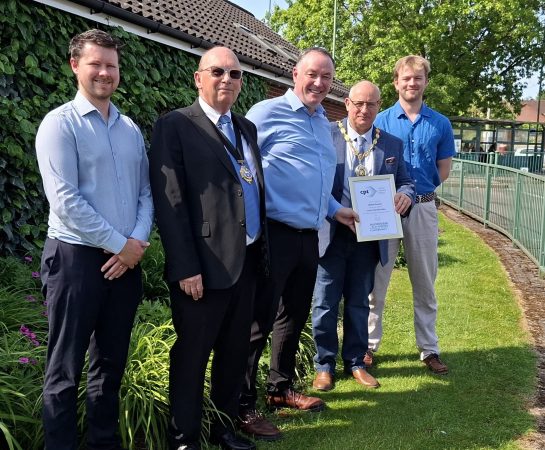 Men holding a certificate