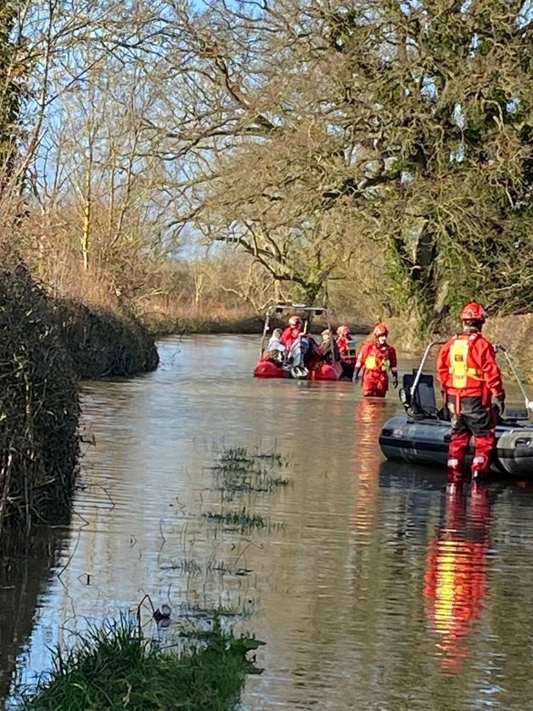 People being rescued from their homes in Melverley by Shropshire Fire and Rescue.