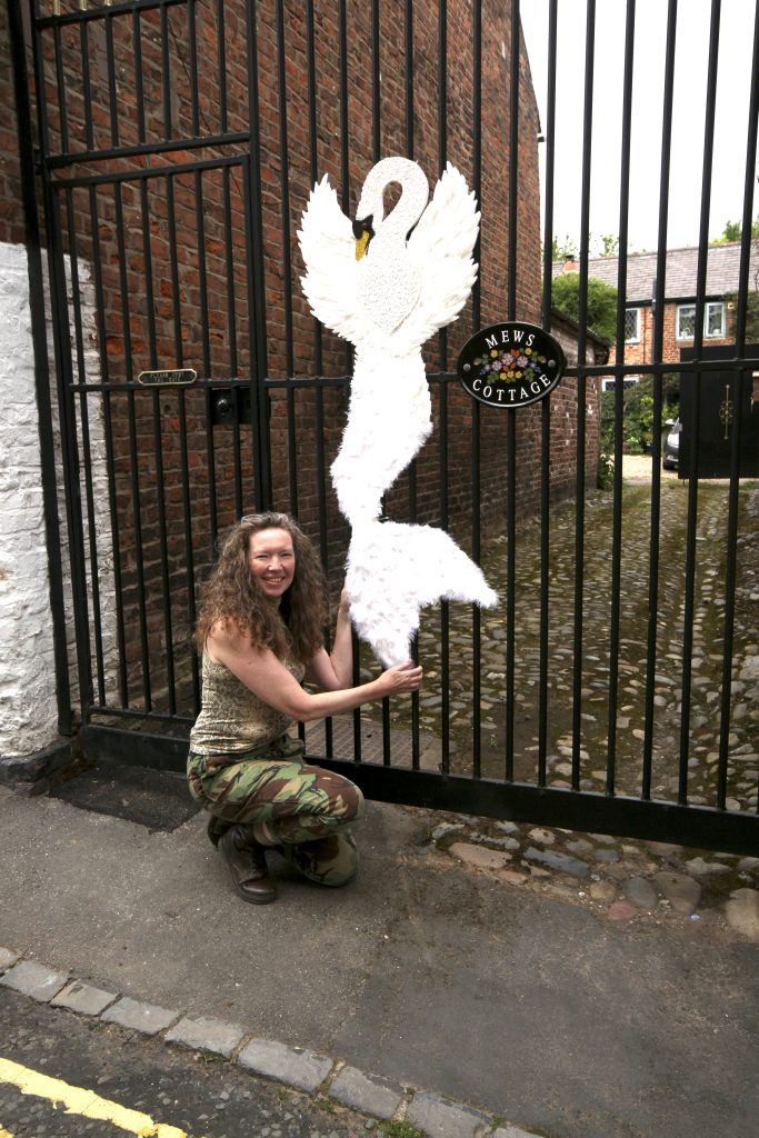 Sally Poynton with her own Meremaid creation made from a feather duster, plastic knives and cotton buds