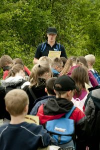 An image of a ranger at Severn Valley Country Park about to lead a group of children on the mini woodland beasts session.