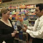 Pharmacist dispensing health advice