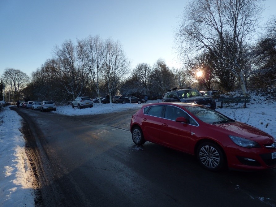 An image of cars parked irresponsibly after people travelled to exercise during lockdown in England. 