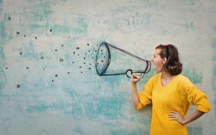 An image of a lady pretending to shout through a sketched megaphone.