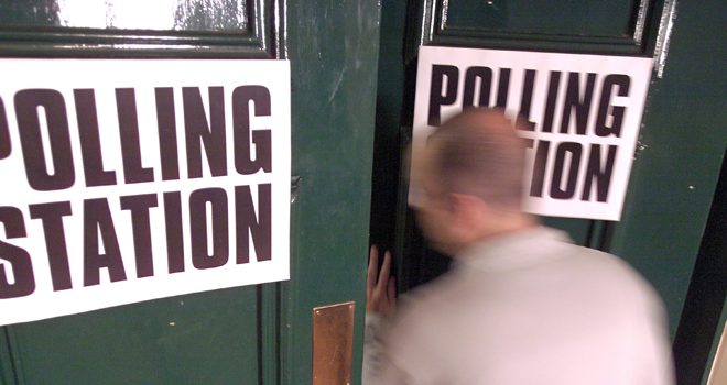 A man entering a polling station