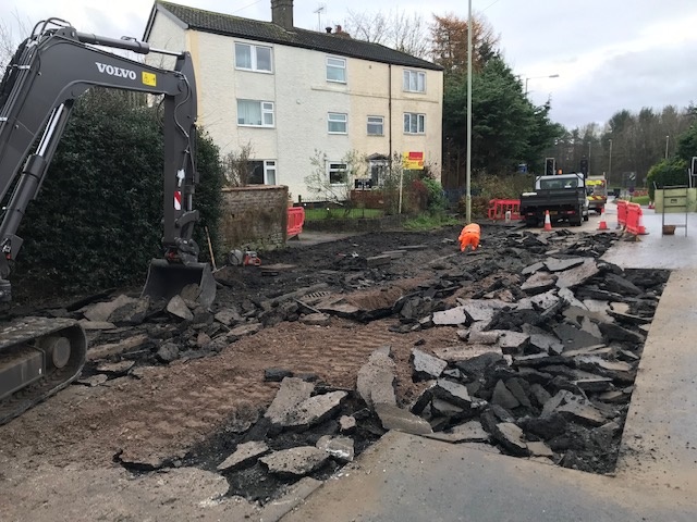 The damage to the A4117 at Rocks Green caused by a burst water main