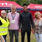 An image of Shrewsbury Town Football Club's Josh Laurent with representatives of SaTH at the NHS charity fun day.