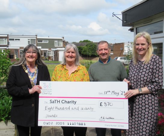 People and a SaTH charity donation
