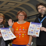An image of 2 ladies and 1 man at Shrewsbury Museum and Art Gallery promoting deaf awareness