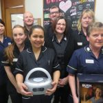 Staff from Pharmacy and EOLC with the CD players