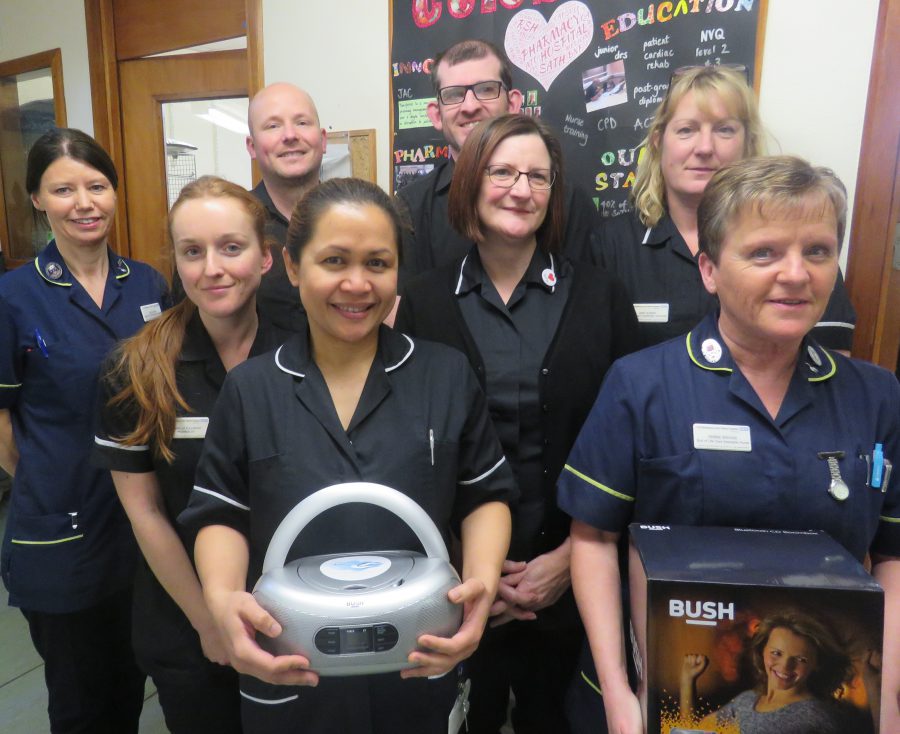 Staff from Pharmacy and EOLC with the CD players