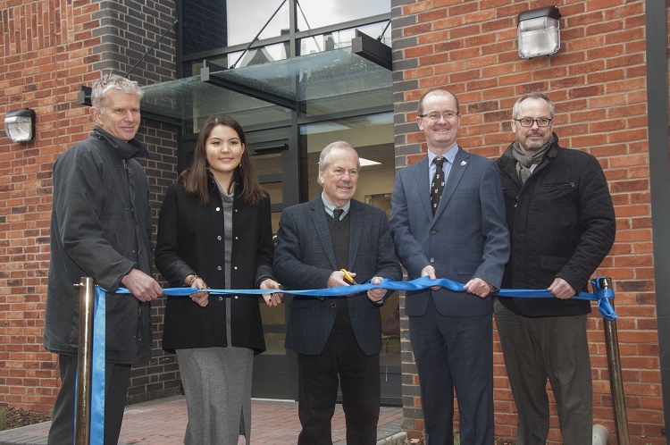A ribbion is cut by Councillor Peter Nutting to officially open the new student accommodation,