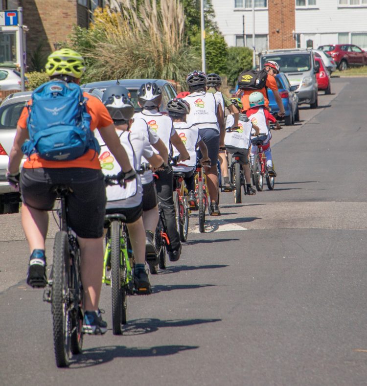 people learning to ride bicycles