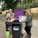 Great Mess to Little Mess litter picking volunteers with one of the new recycling wheelie bins