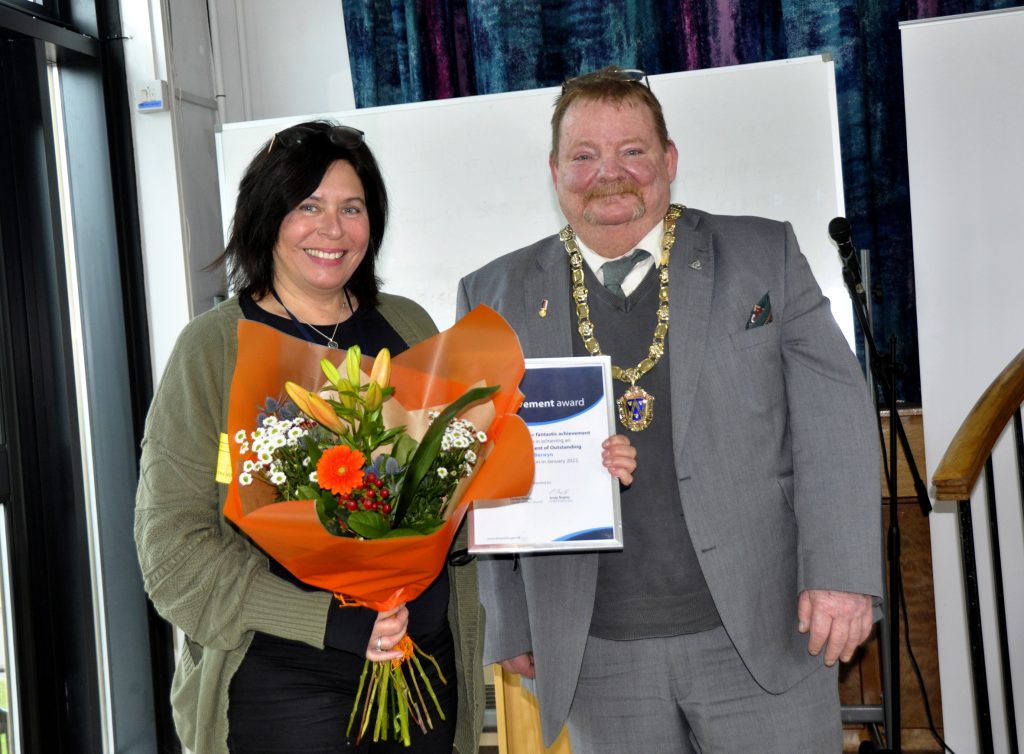 Jo Rocke, Shropshire Council's registered manager -m placements, receiving the OFSTED verdict from Vince Hunt, Chairman, Shropshire Council.