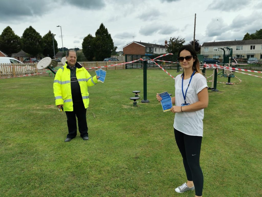 People at Craven Arms playground handing out information
