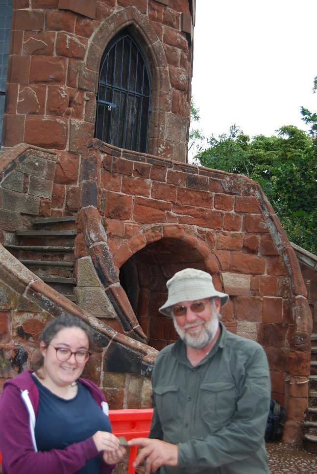 Lucy and Terry with Medieval green glazed pottery that dates some of the features. Picture by Dr Morn Capper