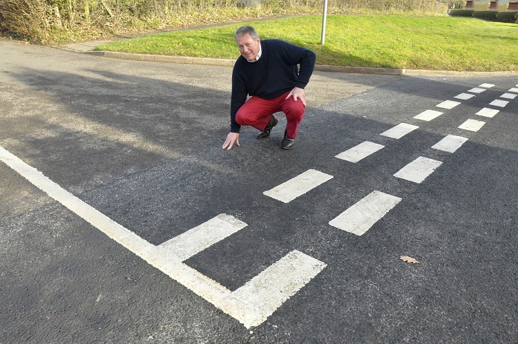 Councillor Steve Davenport inspects the recently completed work in Ditton Priors.