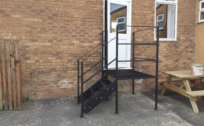The newly-installed fire door and exit stairway.