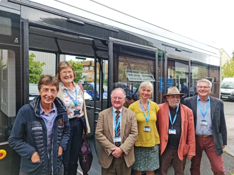 A group of 6 councillors standing in front of the Sigma7 electric bus