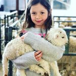 A girl with a sheep.