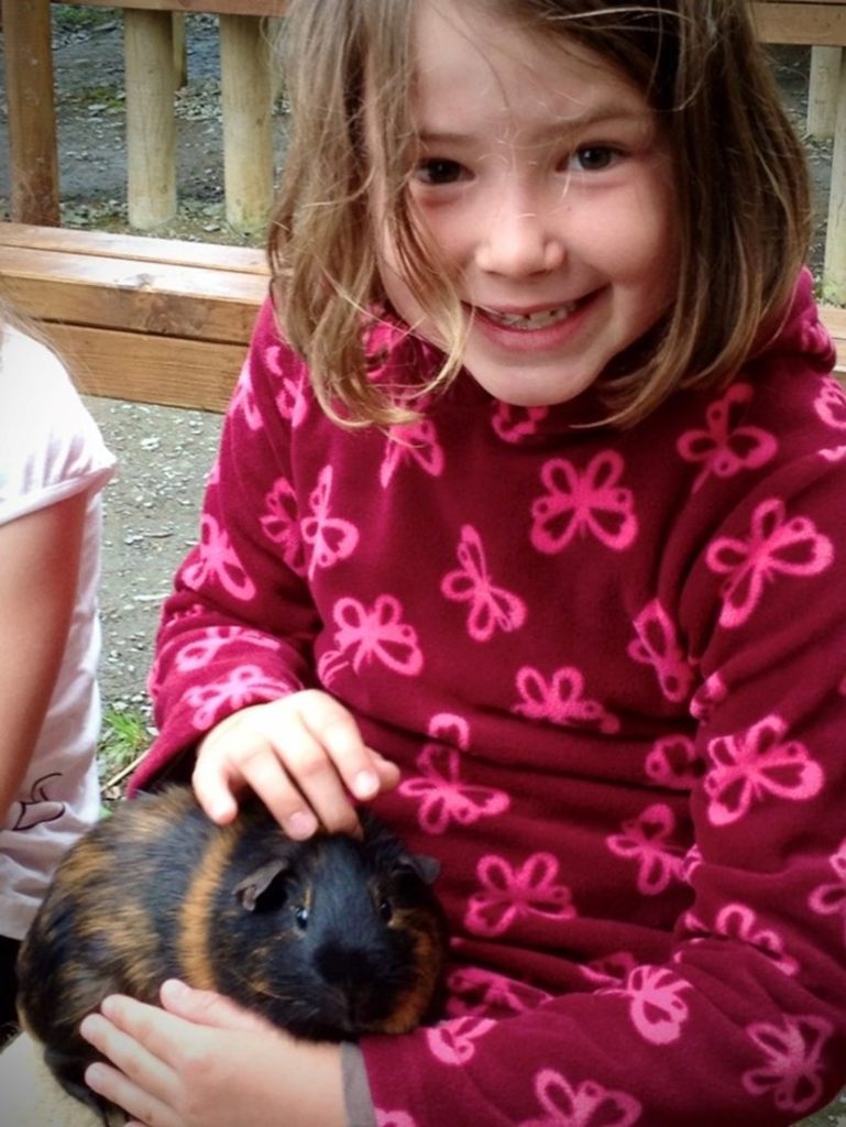 A girl with a guinea pig