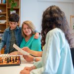 3 people playing chess